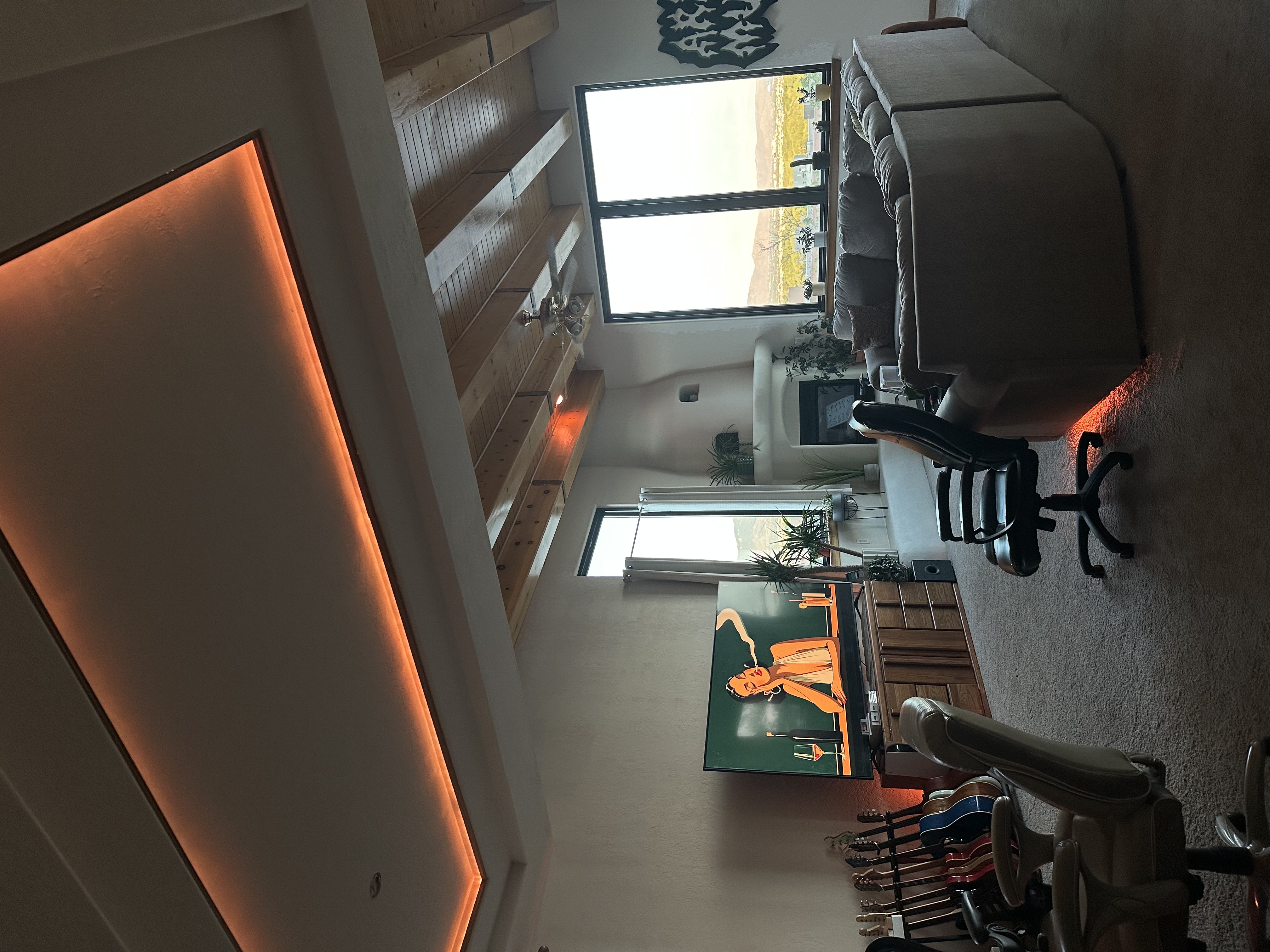 The listening lounge with guitars and amber cove lighting