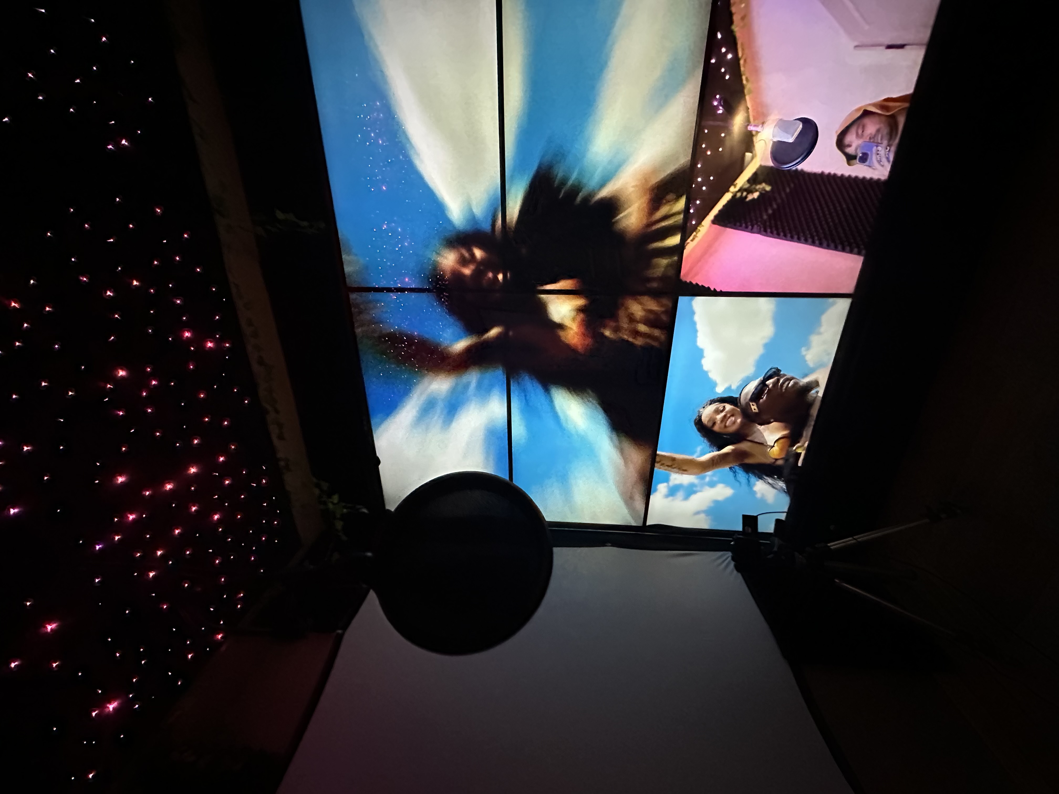 Video-wall booth showing sky visuals